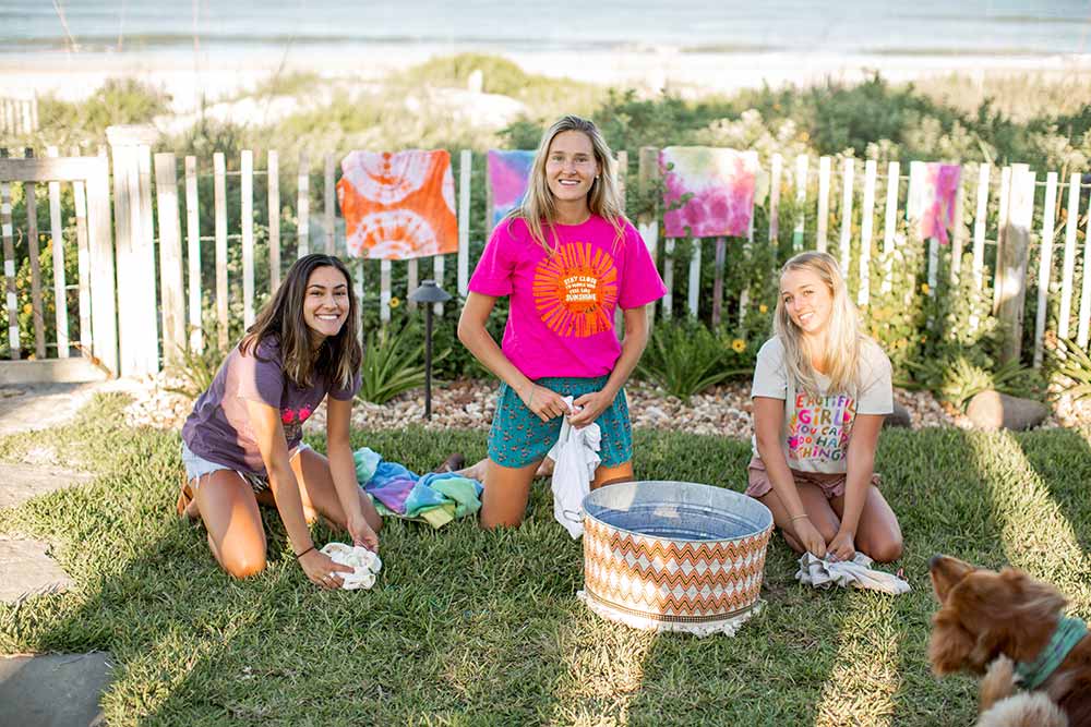 Girls tie-dying wearing cute Natural Life clothes