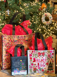 image of happy bags under a christmas tree wrapped like presents