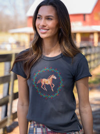 Woman wearing a t-shirt with a horse design outdoors