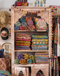 Shelf with colorful sheets stacked