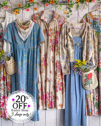 Vintage-style clothing with floral patterns on a wooden background, featuring a sale promotion.