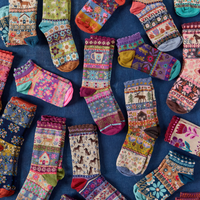 colorful socks laid on a blue background
